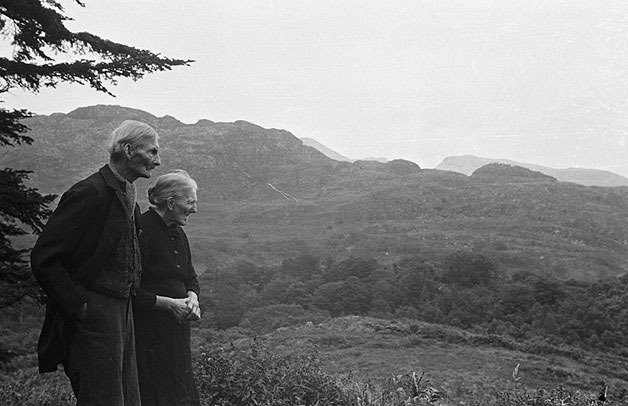 older couple looks across valley view