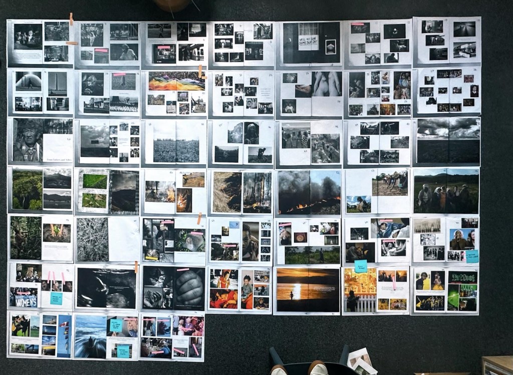 40 photocopied A3-sized spreads neatly laid out on grey carpet floor in the office.