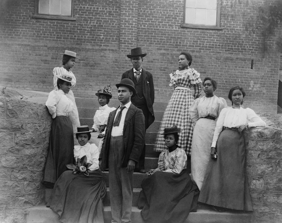 African American men and women posed for portrait on steps at Atlanta University, Georgia